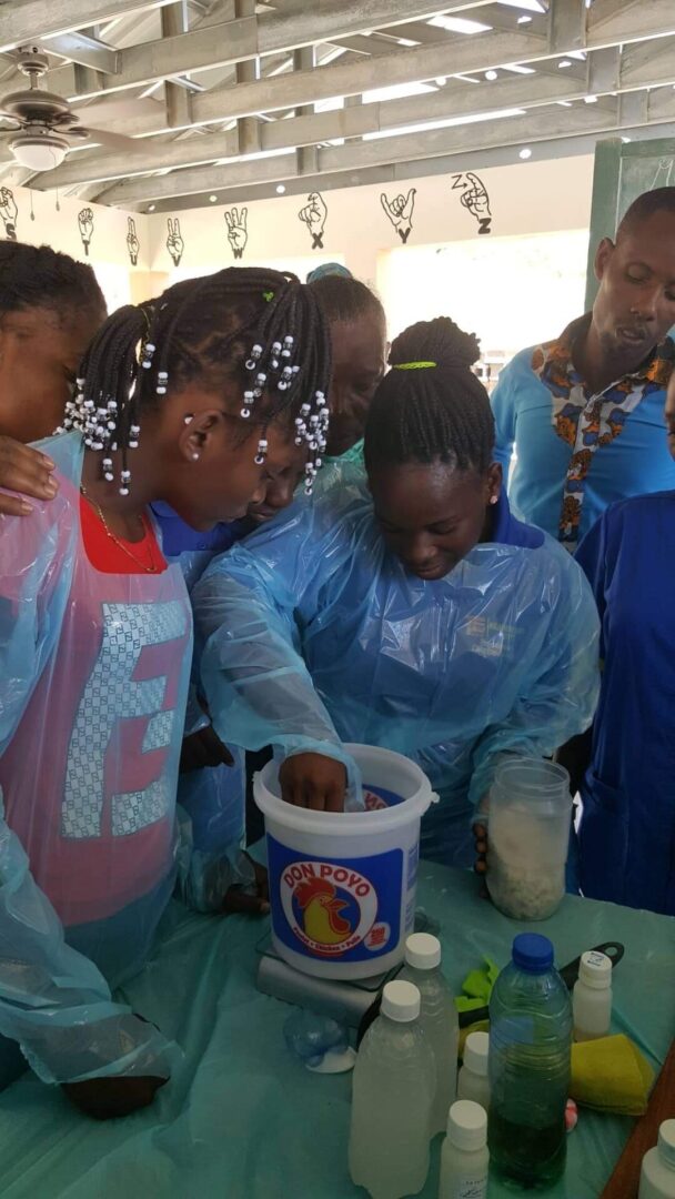 A Girl Mixing Powder in a Bucket