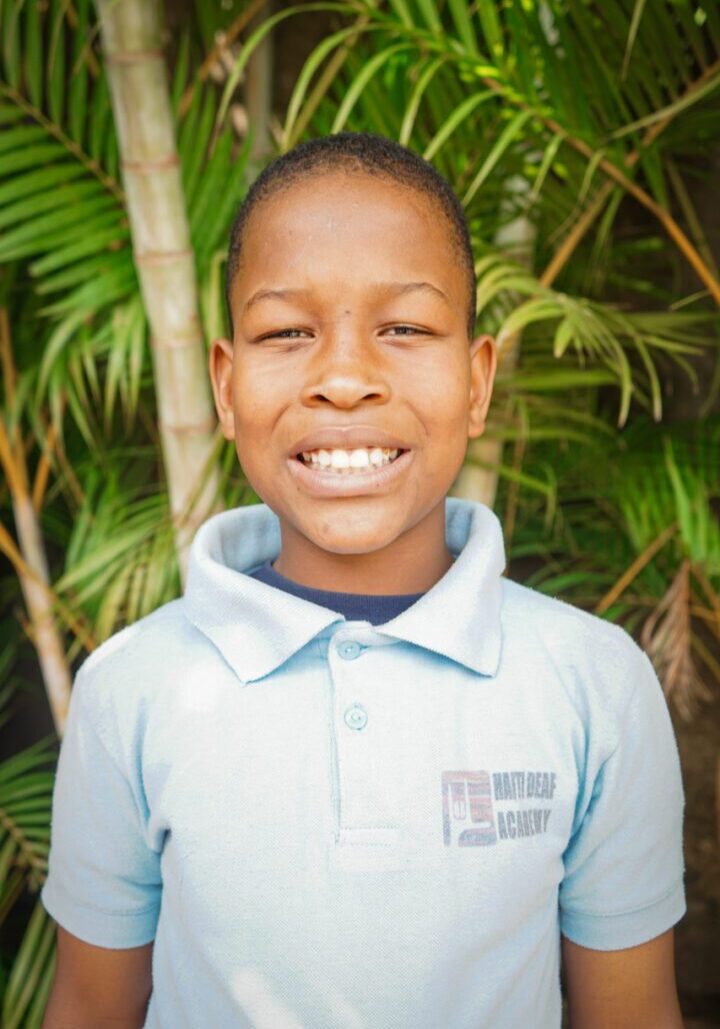 Guerby is shy and kind. He has opened up tremendously to his new friends and is learning language fast. This is his first year at school, and when he is home with his mom she tells us he begs to get back to school! He enjoys playing domino's with other students and is always sitting back laughing at what is going on around him.